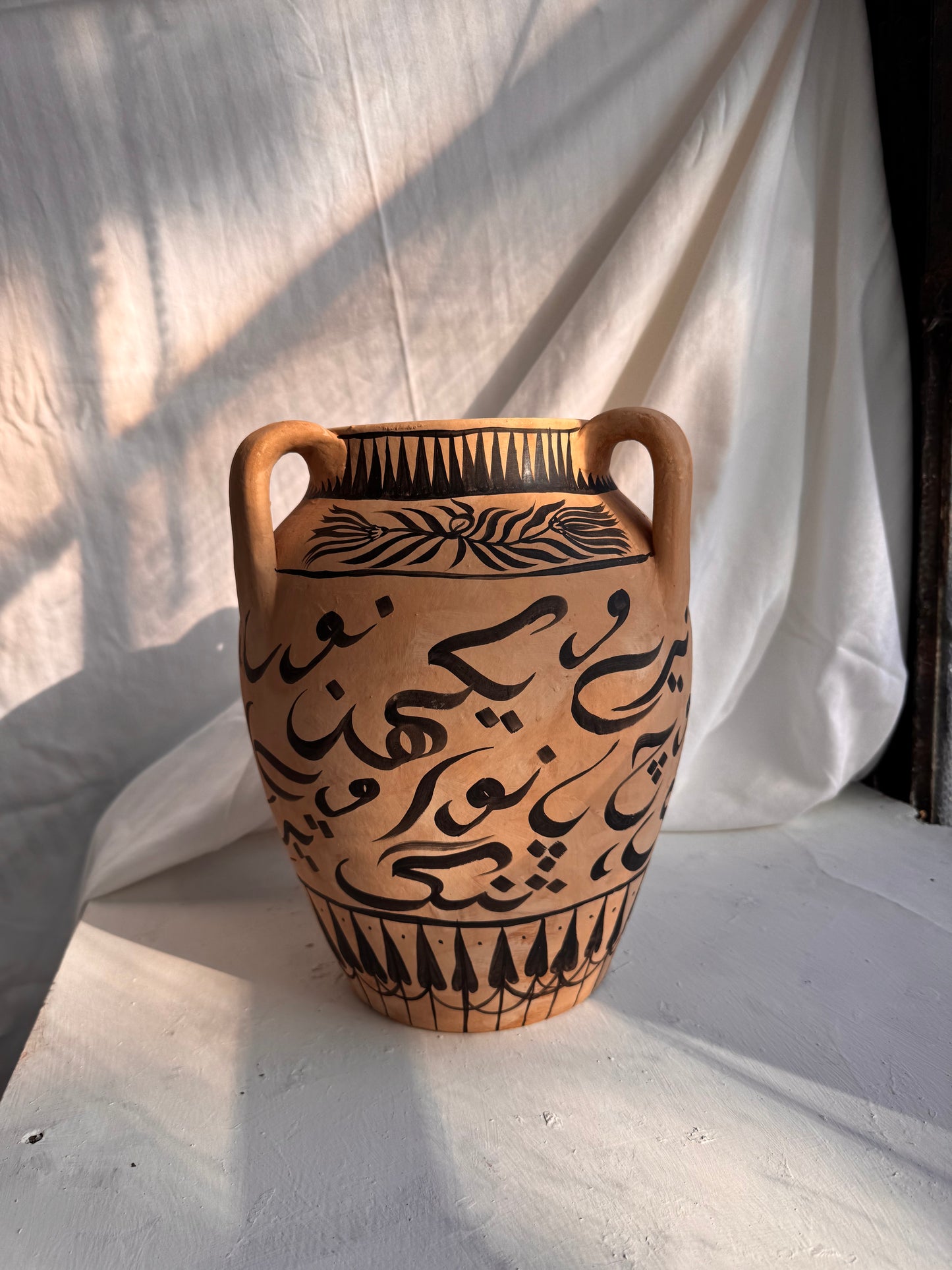 Charkha Bold Script Hellenic Vase