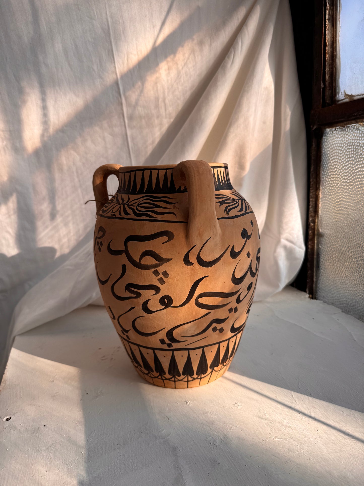 Charkha Bold Script Hellenic Vase